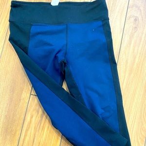 Black and blue Fabletics leggings. Knee length